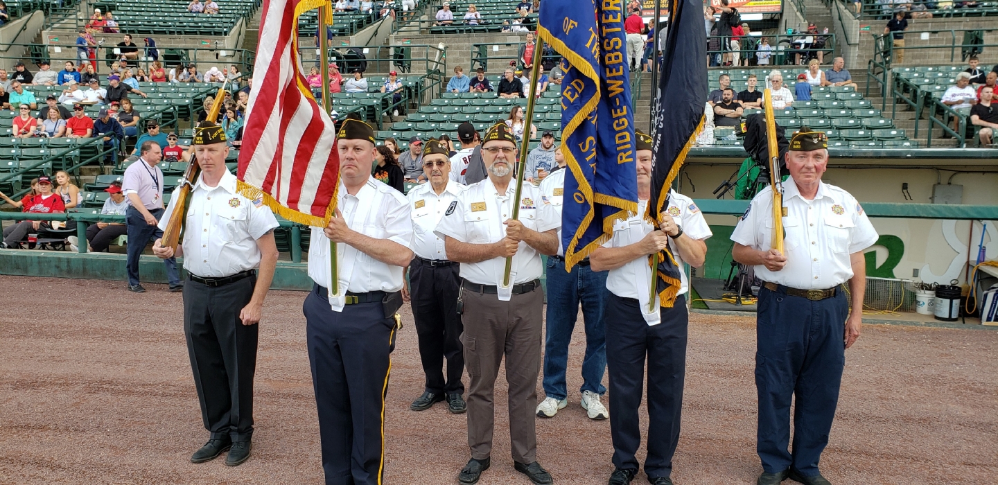 Members of VFW Post 9483 presenting Colors at a Rochester Redwings game.
